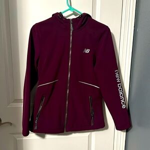 Women’s New Balance size small windbreaker in color purple/pink